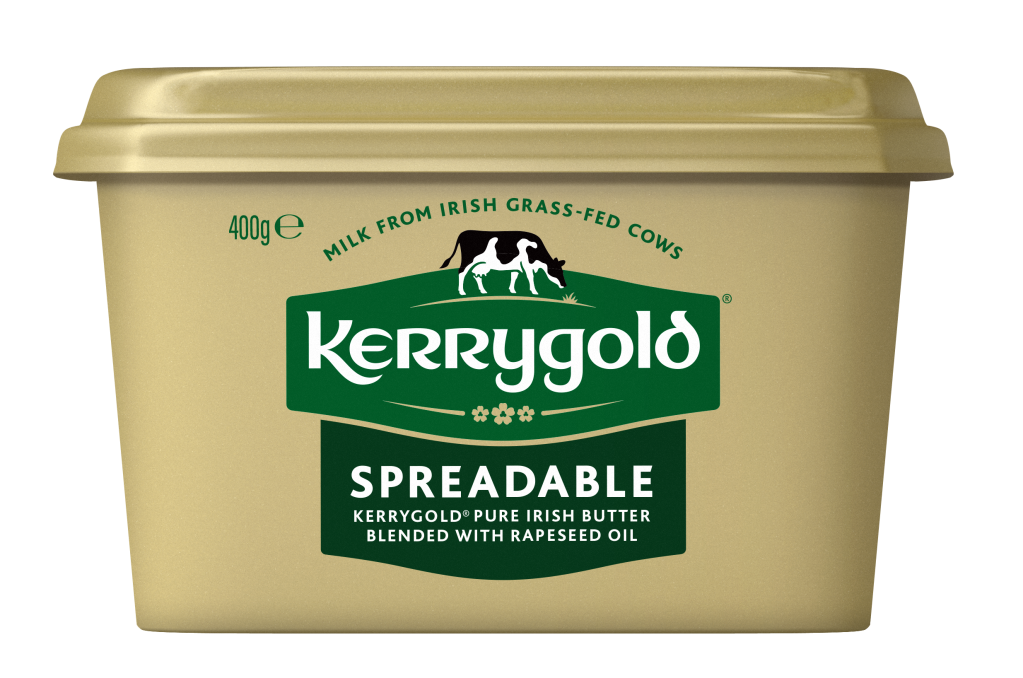 Pack shot of a Kerrygold Spreadable tub on a plain background, featuring a gold container with green Kerrygold logo and text highlighting blended Irish butter with rapeseed oil made from milk from Irish grass-fed cows.