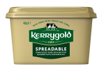 Pack shot of a Kerrygold Spreadable tub on a plain background, featuring a gold container with green Kerrygold logo and text highlighting blended Irish butter with rapeseed oil made from milk from Irish grass-fed cows.