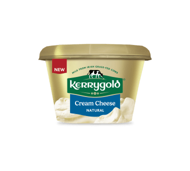 Pack shot of a Kerrygold Cream Cheese Natural tub on a plain background, featuring a gold container with green Kerrygold logo, new label, and text highlighting natural cream cheese made with milk from Irish grass-fed cows.
