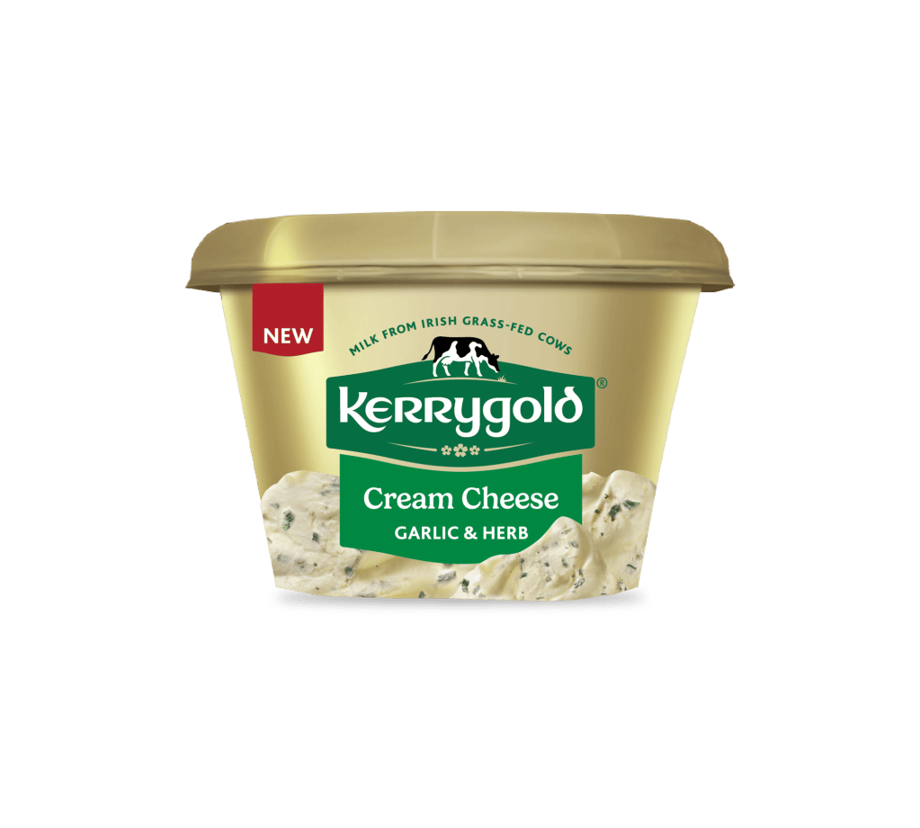 Pack shot of a Kerrygold Cream Cheese Garlic & Herb tub on a plain background, featuring a gold container with green Kerrygold logo, new label, and text highlighting natural cream cheese made with milk from Irish grass-fed cows.